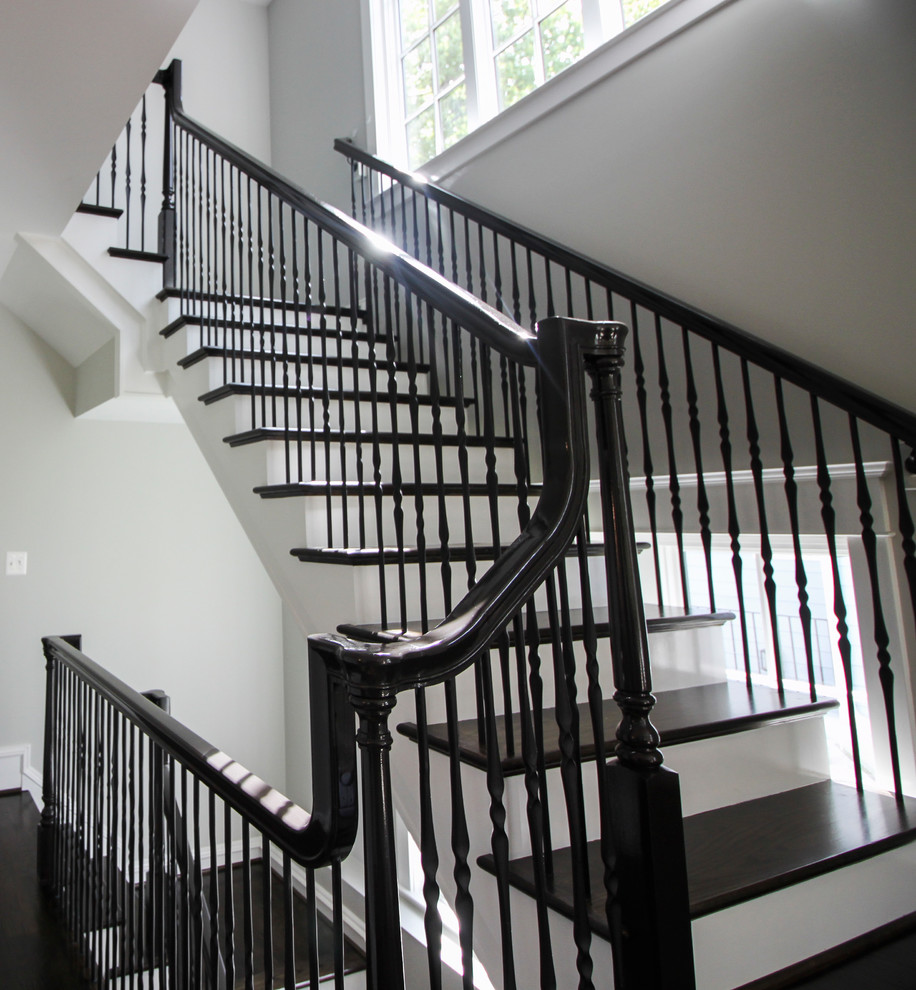 Example of a large transitional wooden l-shaped mixed material railing staircase design in DC Metro with painted risers