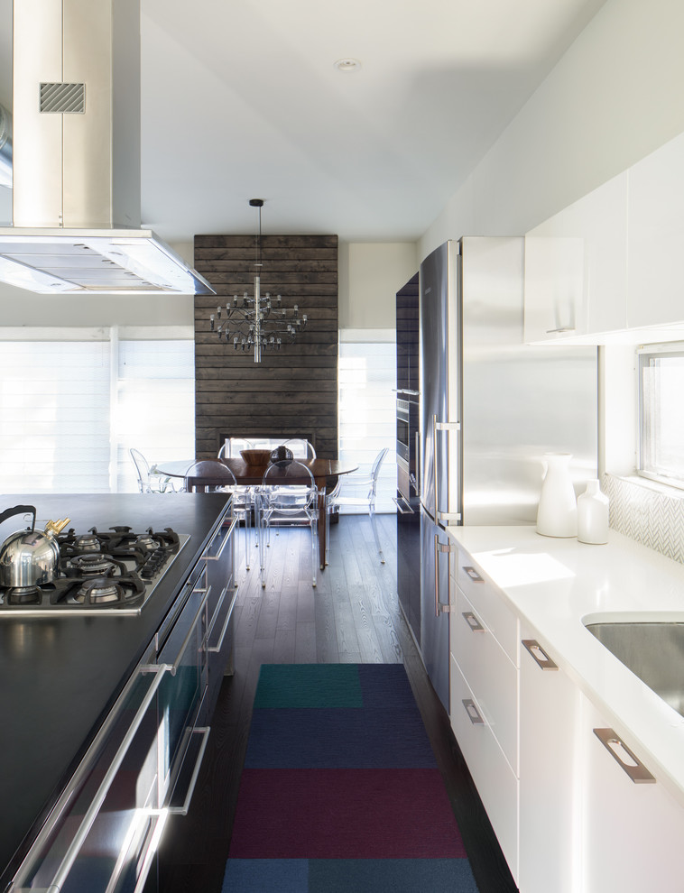 This is an example of a mid-sized contemporary kitchen in Denver.