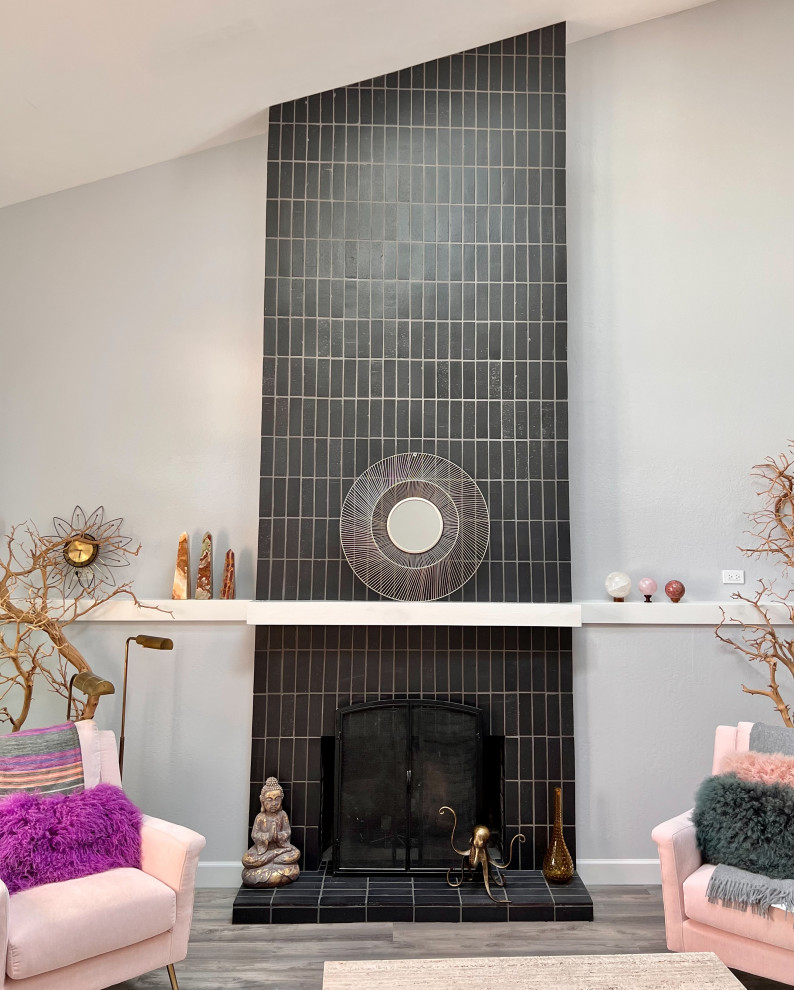 Example of a small minimalist black floor living room design in San Francisco with a brick fireplace