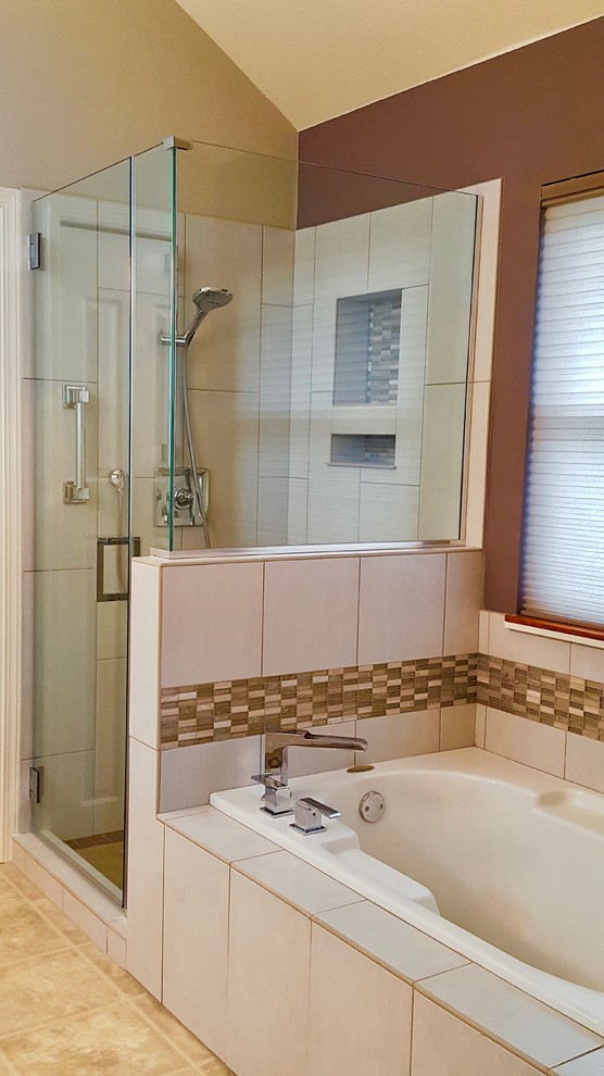 This is an example of a mid-sized contemporary bathroom with shaker cabinets, white cabinets, a drop-in tub, a corner shower, beige tile, ceramic tile, beige walls, an undermount sink and vinyl floors.