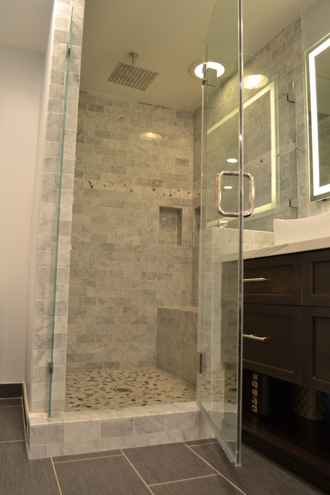 Large modern master bathroom in Los Angeles with shaker cabinets, dark wood cabinets, a drop-in tub, an alcove shower, white tile, pebble tile, beige walls, vinyl floors, a vessel sink, quartzite benchtops, brown floor, a hinged shower door and white benchtops.