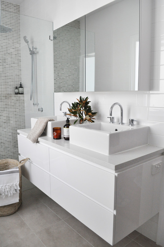 Contemporary bathroom in Brisbane with a vessel sink and white tile.