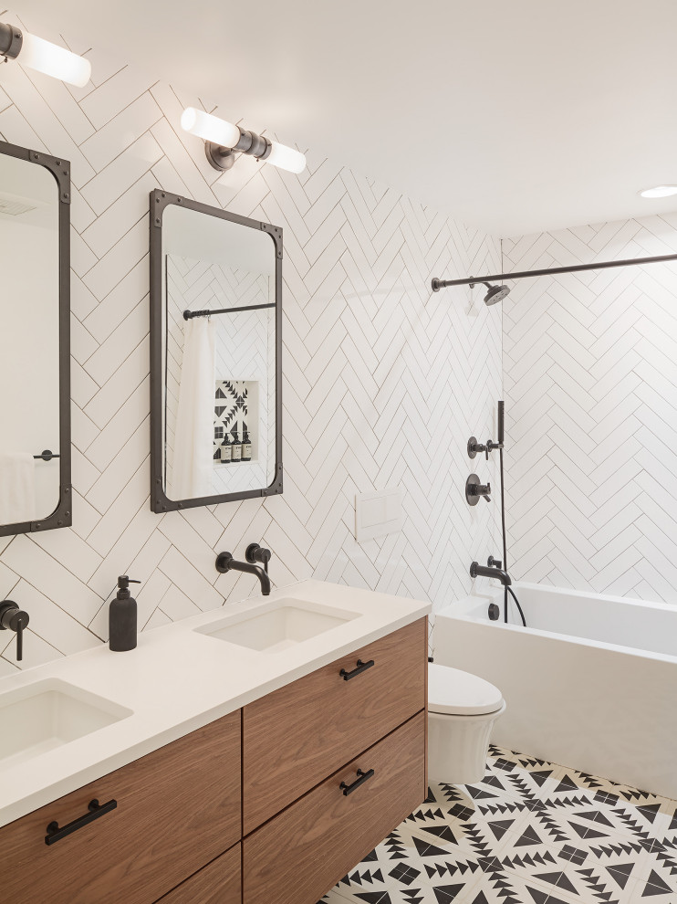 Inspiration for a contemporary bathroom in Philadelphia with flat-panel cabinets, medium wood cabinets, an alcove tub, white tile, an undermount sink, multi-coloured floor, a shower curtain, white benchtops, a double vanity and a floating vanity.