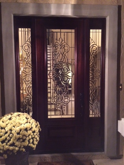 Photo of a mid-sized traditional front door in Jacksonville with a single front door and a dark wood front door.