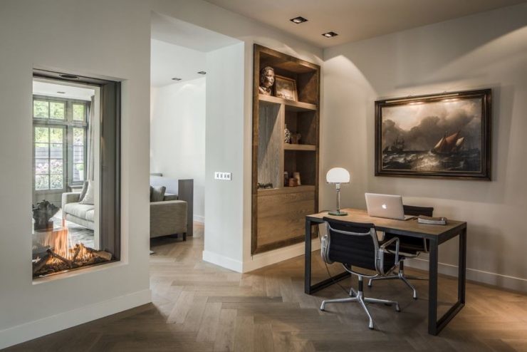 Large modern home office in Boston with no fireplace and a plaster fireplace surround.
