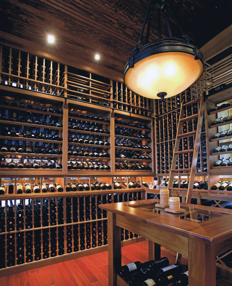 Traditional wine cellar in Philadelphia with medium hardwood floors and display racks.