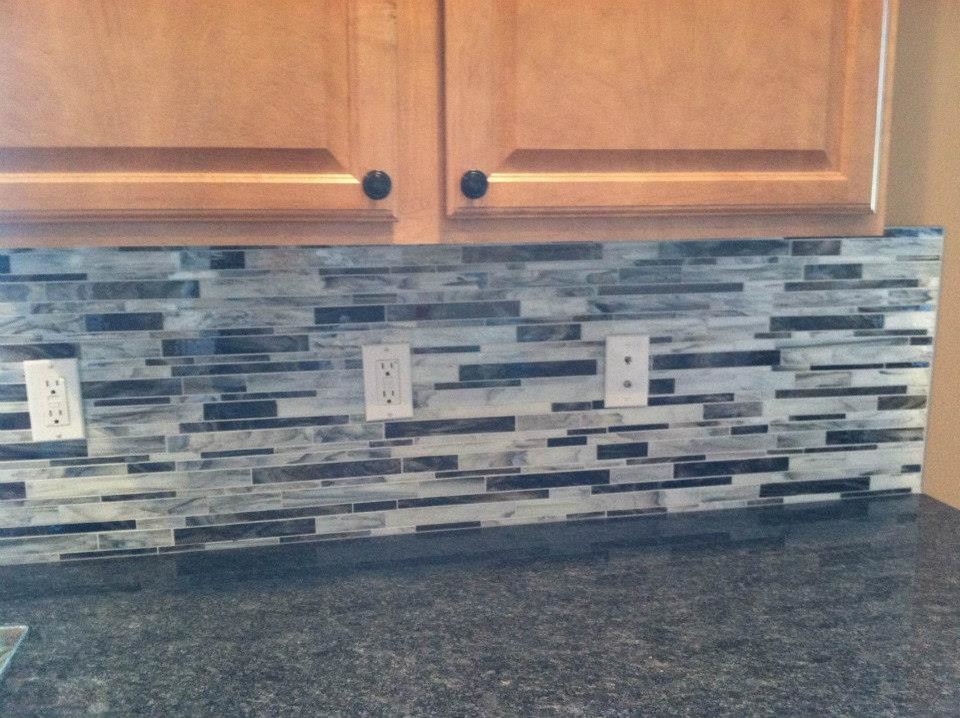 Kitchen - transitional kitchen idea with light wood cabinets, granite countertops, multicolored backsplash, matchstick tile backsplash and no island