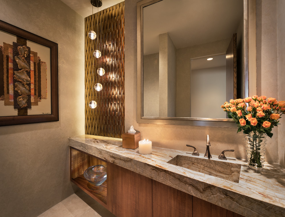 Mid-sized contemporary powder room in Phoenix with flat-panel cabinets, medium wood cabinets, glass tile, beige walls, travertine floors, an integrated sink, granite benchtops and beige tile.