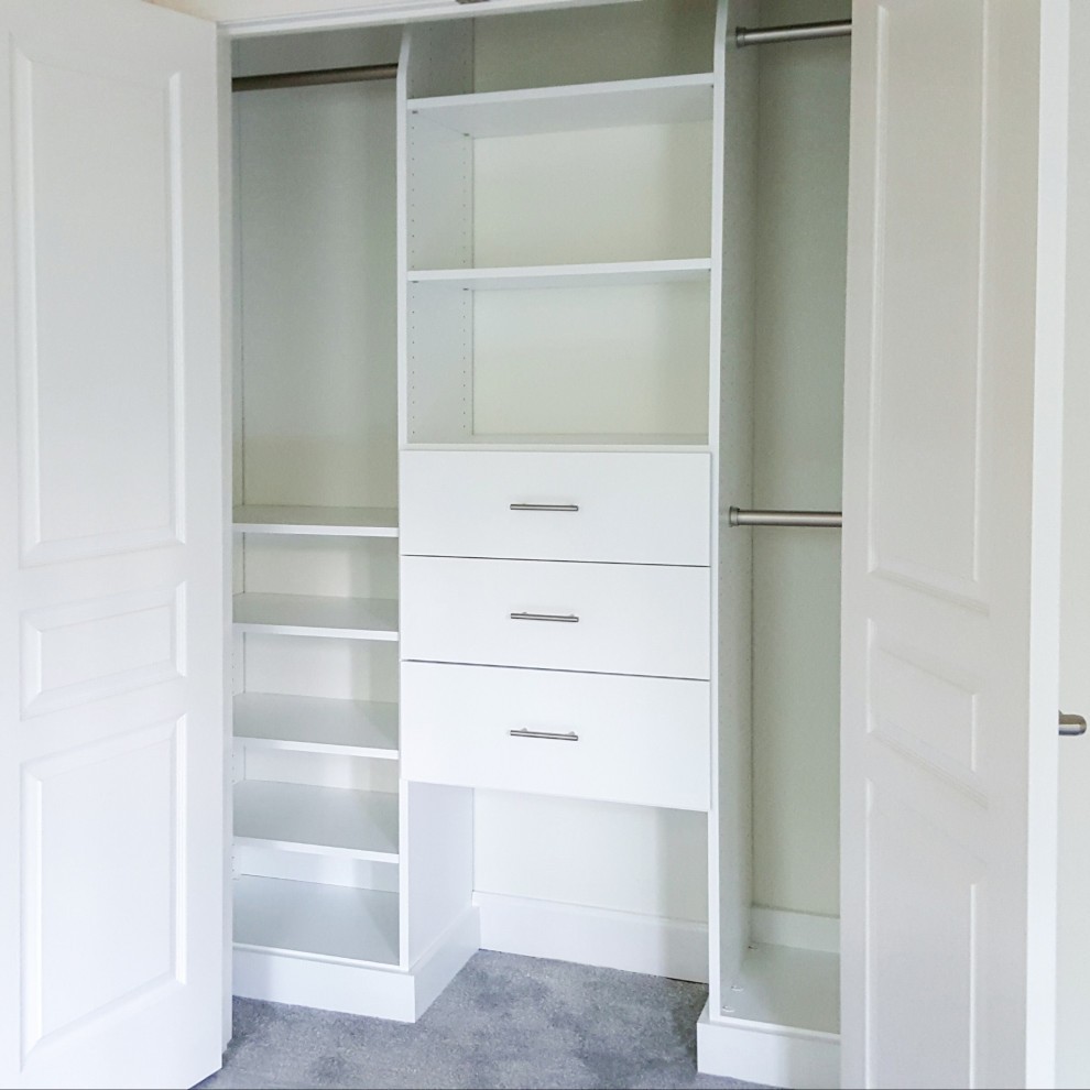 Transitional closet photo with white cabinets