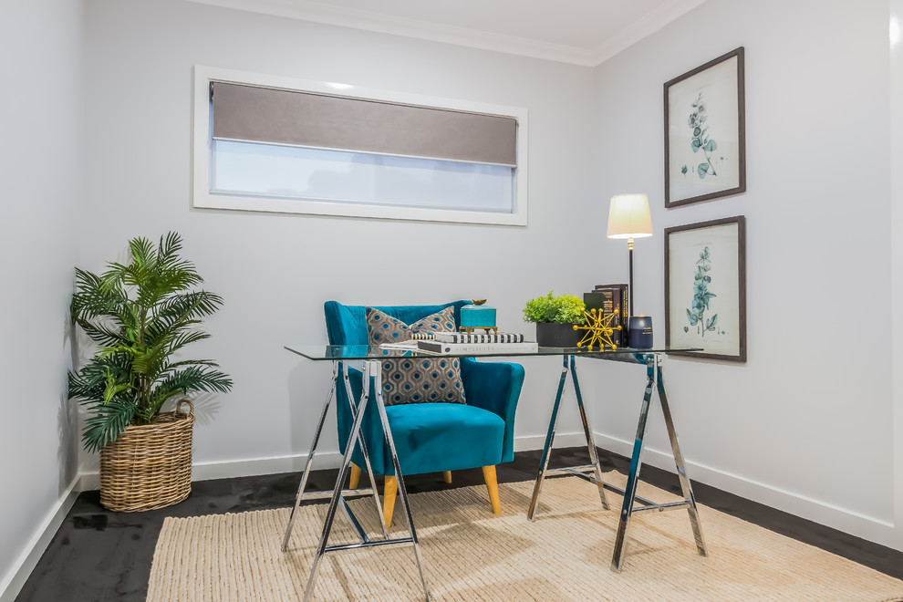 This is an example of a beach style study room in Brisbane with grey walls, a freestanding desk and no fireplace.