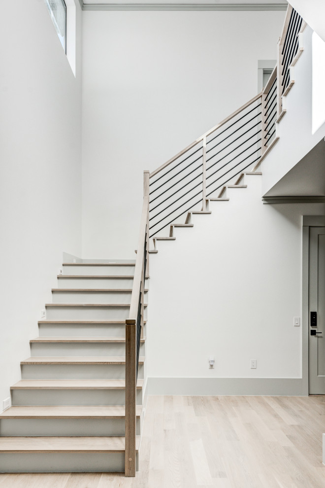 Staircase - mid-sized transitional wooden l-shaped wood railing staircase idea in Dallas with metal risers
