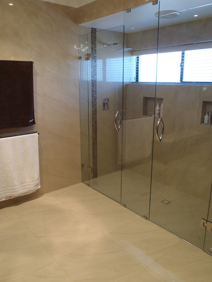 Large transitional master bathroom in Perth with a double shower, beige tile, porcelain tile, beige walls and porcelain floors.
