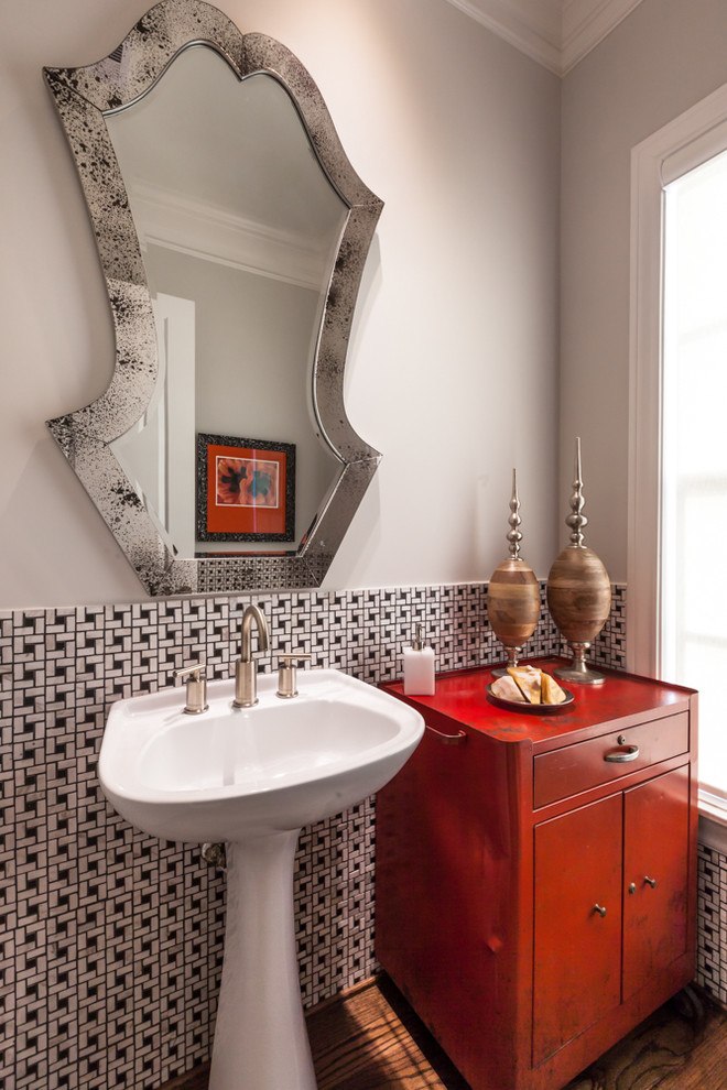 Small transitional powder room in Houston with flat-panel cabinets, red cabinets, black and white tile, grey walls and medium hardwood floors.