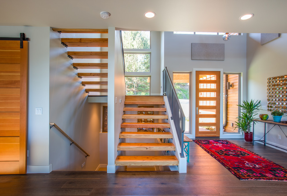 Inspiration for a mid-sized contemporary wood staircase in Seattle with open risers.