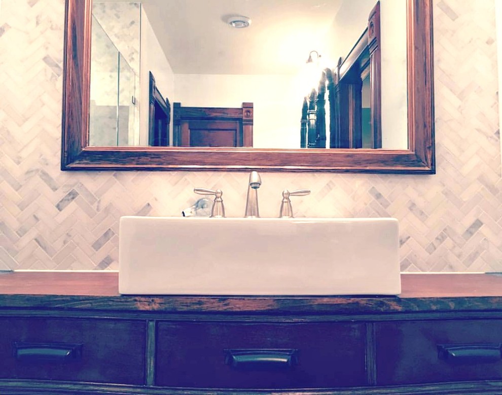 Mid-sized transitional master bathroom photo with flat-panel cabinets, dark wood cabinets, a drop-in sink and wood countertops