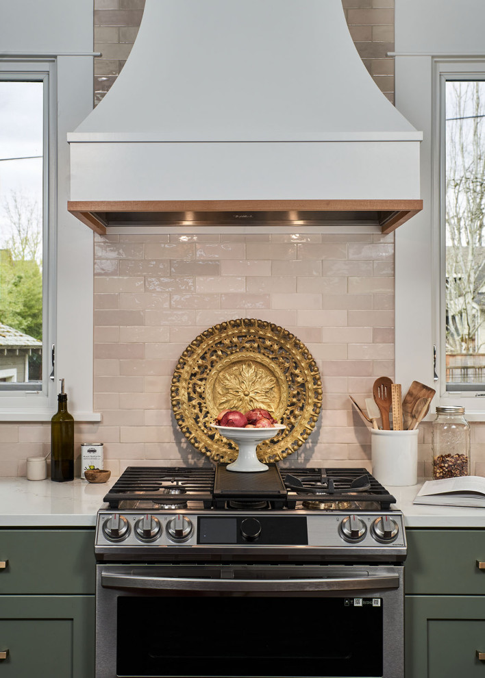 Inspiration for a mid-sized transitional l-shaped beige floor eat-in kitchen remodel in Portland with a farmhouse sink, shaker cabinets, green cabinets, quartzite countertops, beige backsplash, ceramic backsplash, no island and white countertops