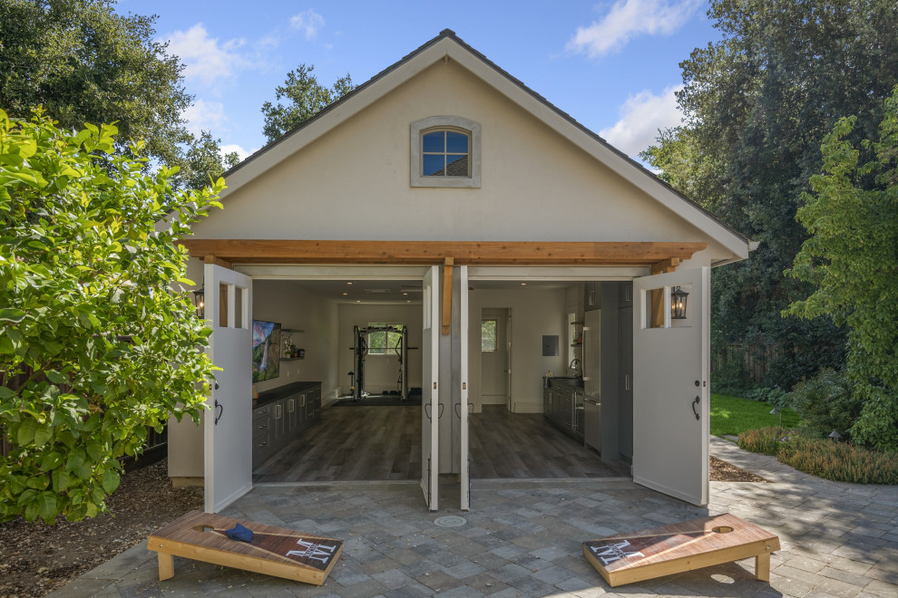 Example of a mid-sized arts and crafts detached two-car garage workshop design in San Francisco