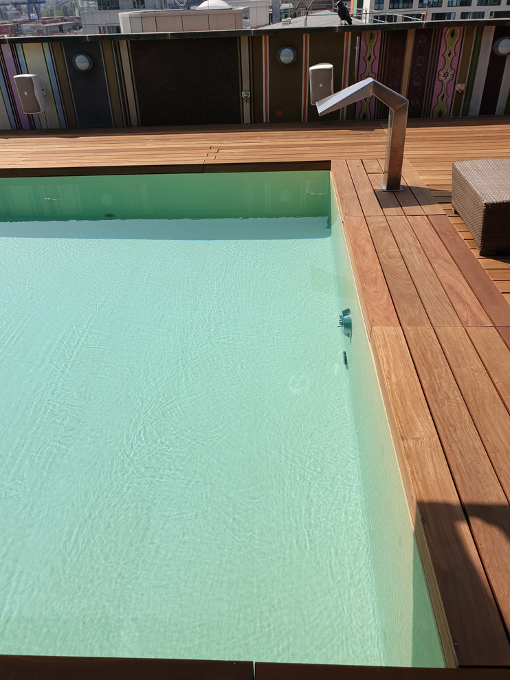 Inspiration for a large mediterranean rectangular pool in Frankfurt with decking.