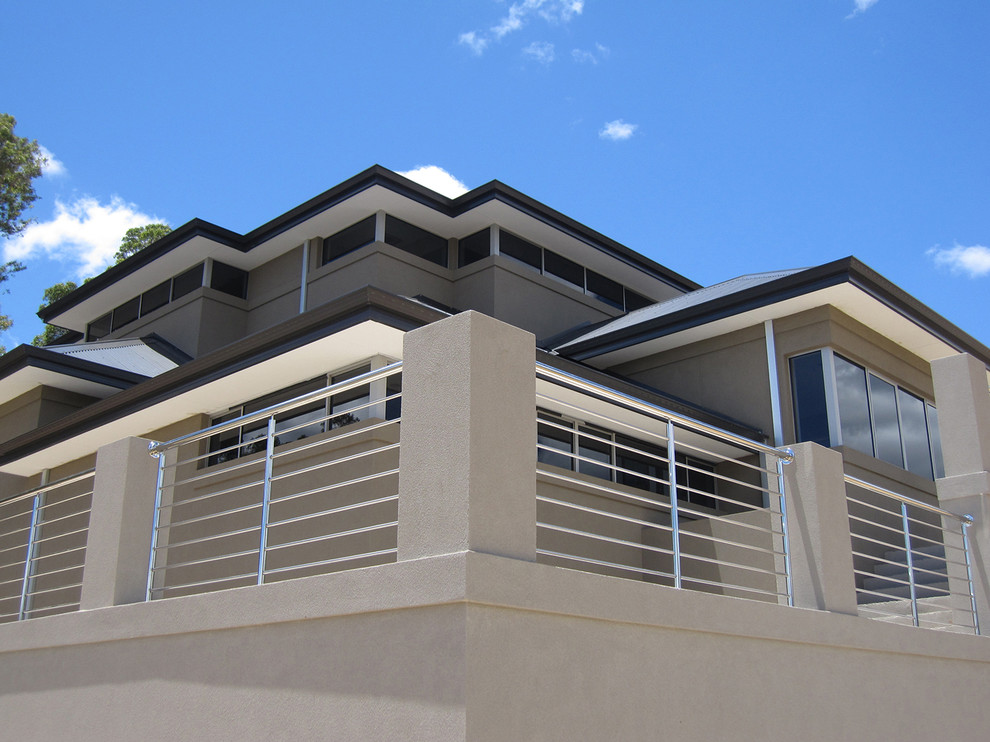 Expansive contemporary split-level grey exterior in Perth with a hip roof.