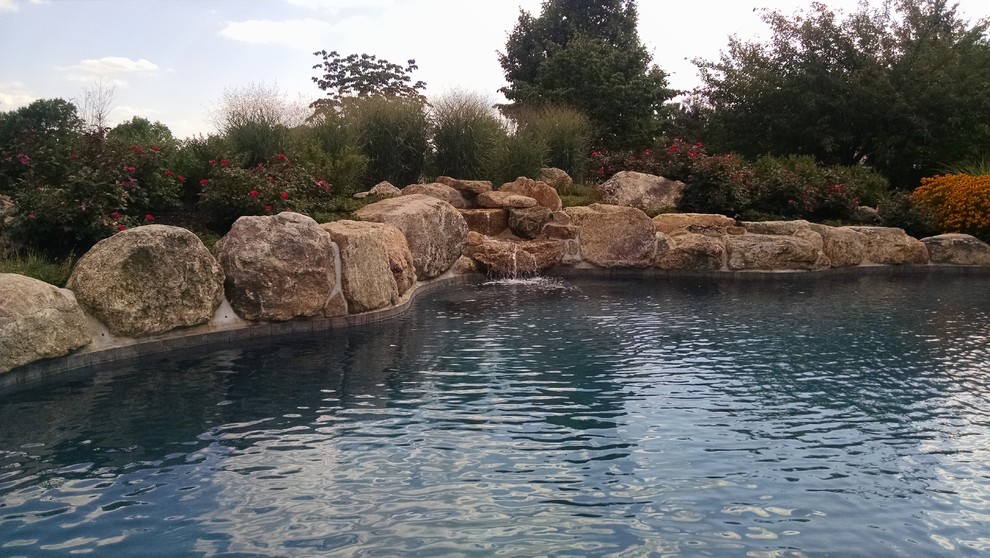 Mountain style pool photo in New York