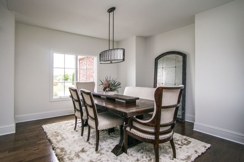 Dining room - mid-sized transitional dark wood floor and black floor dining room idea in Chicago with white walls