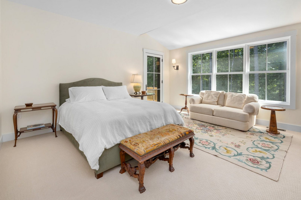 Photo of a medium sized farmhouse guest bedroom in Boston with white walls, carpet and white floors.