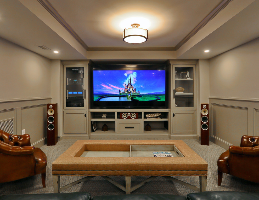 Mid-sized transitional enclosed home theatre in Boston with beige walls, carpet, a built-in media wall and grey floor.