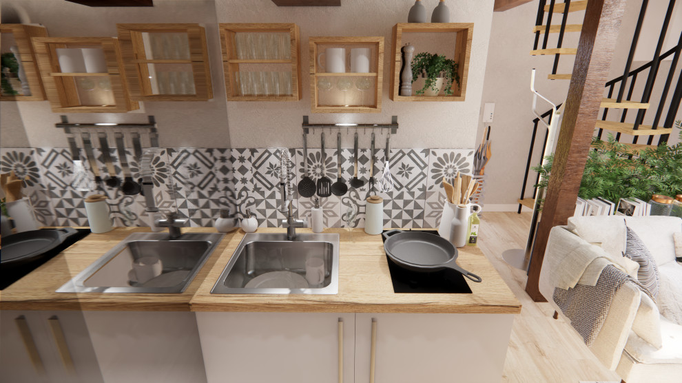 Inspiration for a small country galley kitchen in Dijon with a single-bowl sink, wood benchtops, grey splashback, cement tile splashback, panelled appliances, light hardwood floors, no island, beige floor and beige benchtop.