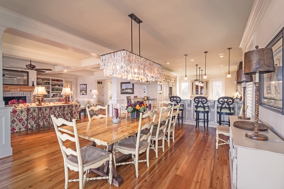 Design ideas for a large traditional open plan dining in Charleston with white walls, no fireplace, medium hardwood floors and brown floor.