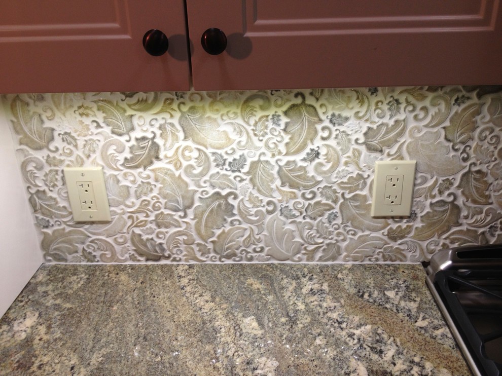 Example of a kitchen design in Edmonton with multicolored backsplash and ceramic backsplash