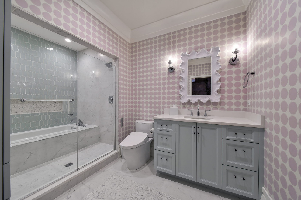 Large eclectic kids bathroom in Chicago with flat-panel cabinets, green cabinets, a drop-in tub, a shower/bathtub combo, a two-piece toilet, white tile, porcelain tile, purple walls, marble floors, an undermount sink, engineered quartz benchtops, white floor, a hinged shower door, white benchtops, a shower seat, a single vanity, a built-in vanity and wallpaper.