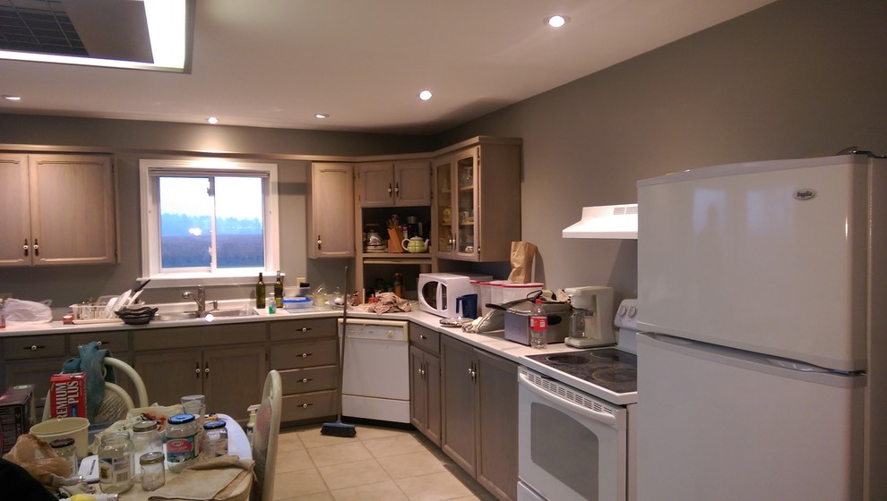 Mid-sized transitional master vinyl floor and multicolored floor kitchen photo with recessed-panel cabinets, medium tone wood cabinets, a two-piece toilet, gray walls, laminate countertops and yellow countertops