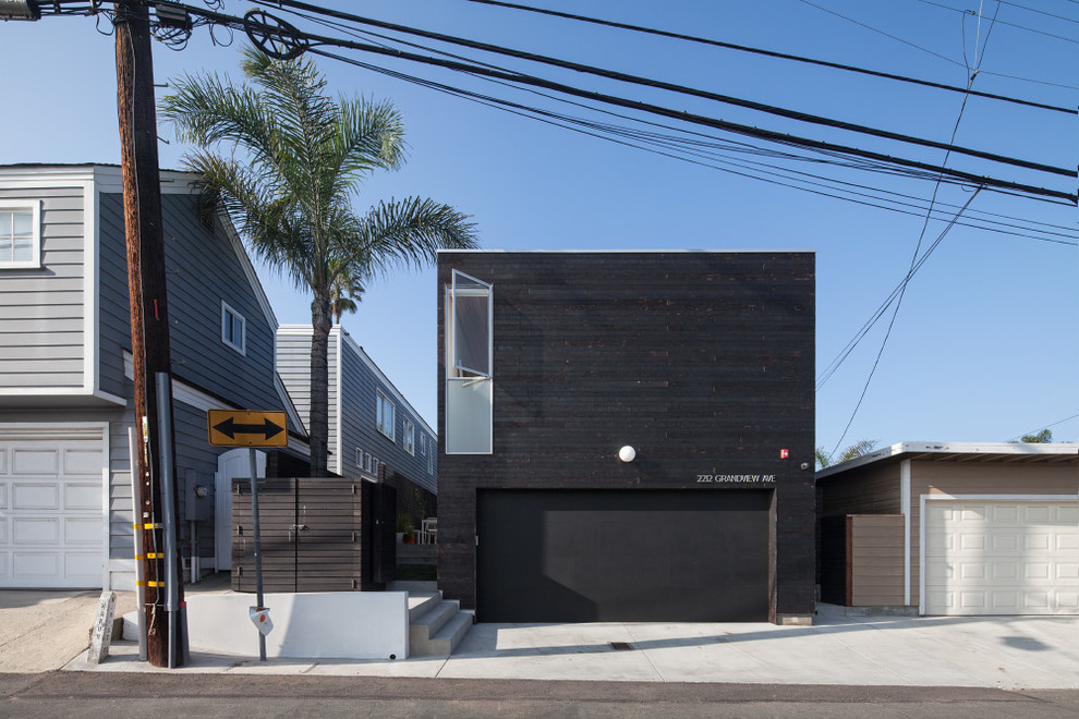 Inspiration for a mid-sized modern attached two-car garage in Los Angeles.