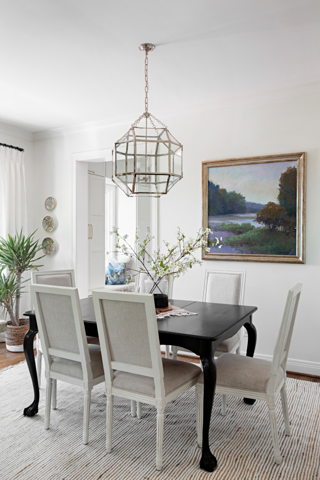 Traditional dining room in Nashville with white walls and dark hardwood floors.