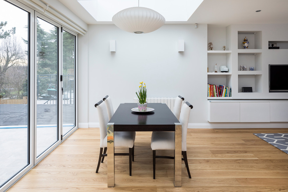 This is an example of a contemporary dining room in Essex.