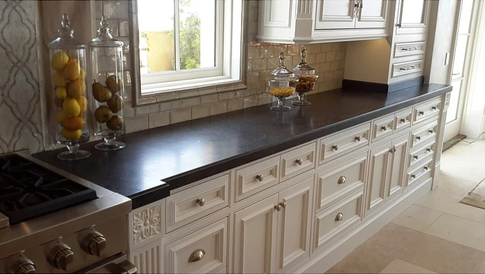 Huge kitchen photo in Orange County with an island