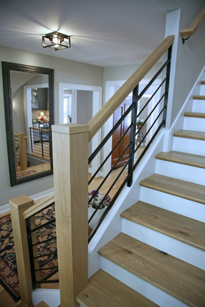 Photo of a medium sized coastal wood l-shaped mixed railing staircase in Milwaukee with painted wood risers.