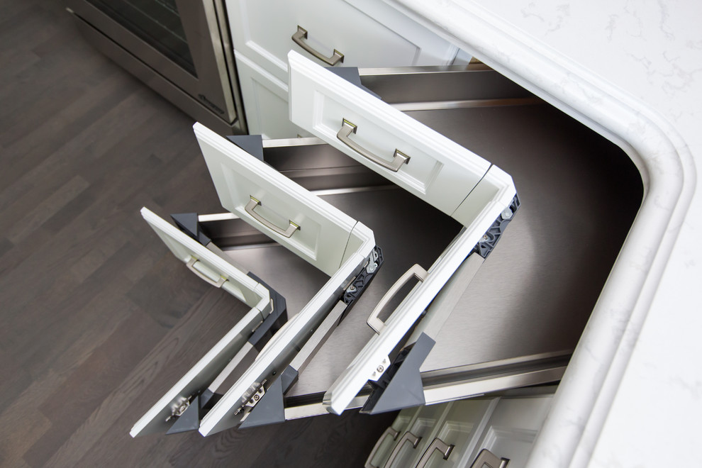 Transitional light wood floor staircase photo in Toronto with recessed-panel cabinets, white cabinets, quartz countertops, white backsplash and stainless steel appliances