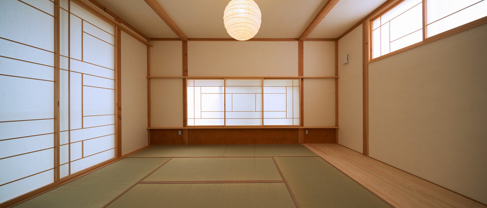 Inspiration for a small enclosed family room in Other with white walls, tatami floors, no fireplace, no tv and green floor.