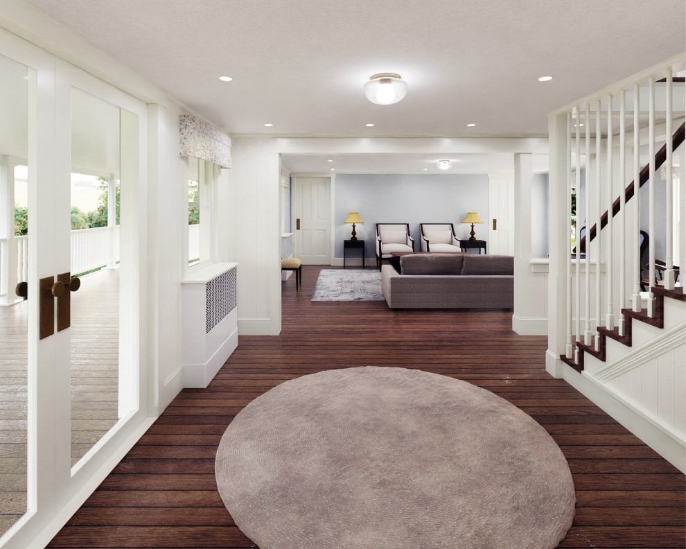 Example of a mid-sized country dark wood floor and wainscoting entryway design in New York with white walls and a glass front door