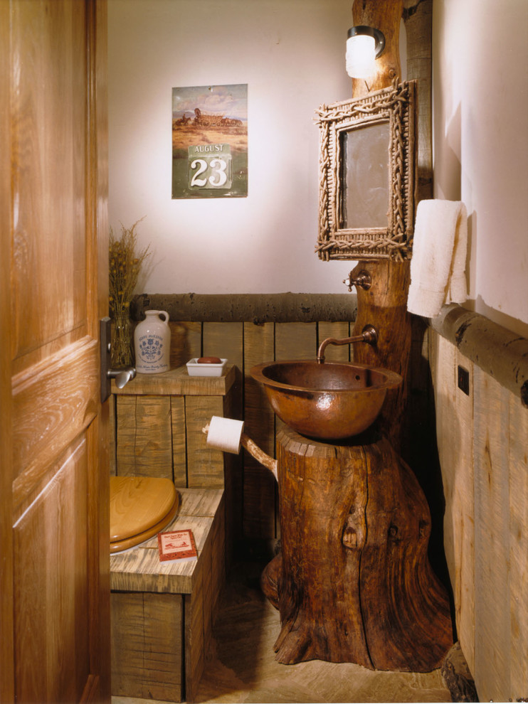 Country powder room in Denver with a vessel sink.