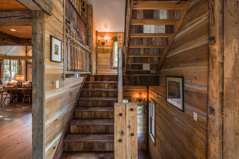 This is an example of a mid-sized country wood u-shaped staircase in Other with wood risers.
