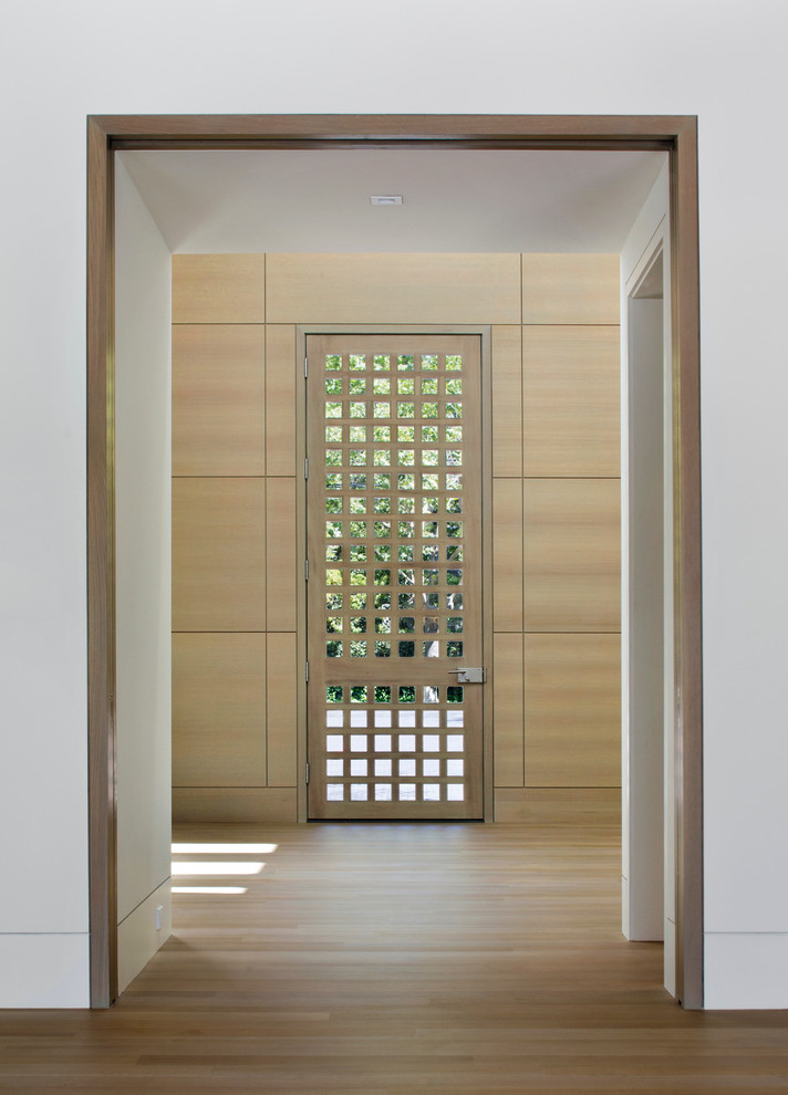 This is an example of a contemporary entryway in San Francisco with white walls.