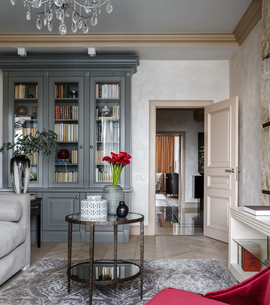 Inspiration for a traditional enclosed living room in Moscow with beige walls, beige floor and a library.