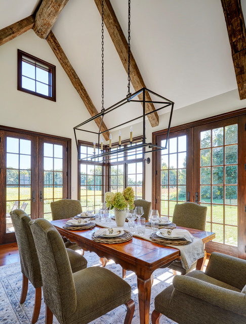 Dining Room With Vaulted Ceiling And Hand Hewn Beams Country