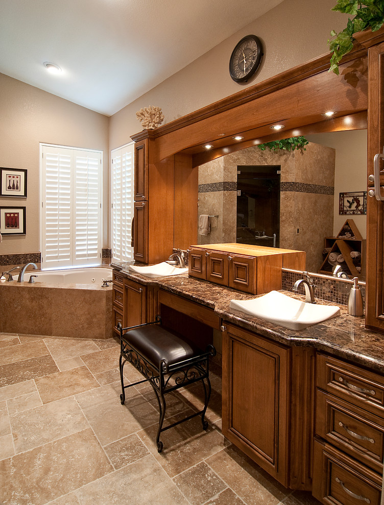 This is an example of a large traditional bathroom in Phoenix with raised-panel cabinets, medium wood cabinets, an undermount tub, a one-piece toilet, beige tile, stone tile, beige walls, travertine floors, a drop-in sink, marble benchtops and with a sauna.