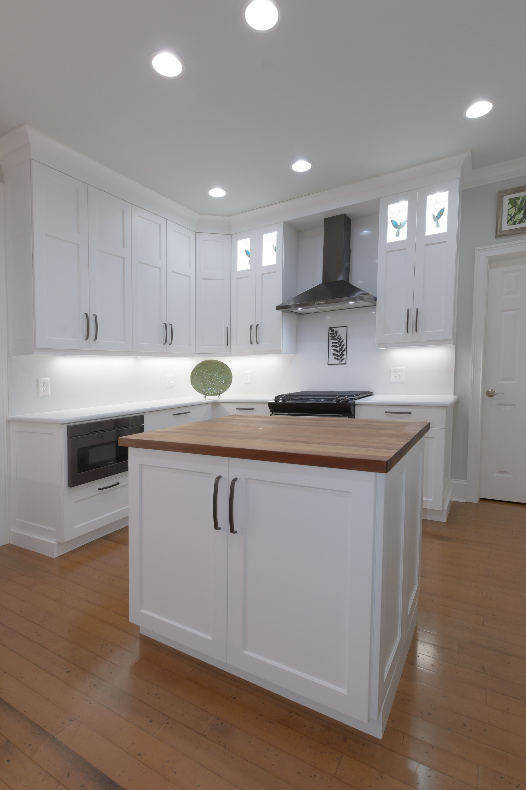 Pawley's Island modern white kitchen with butcher block island