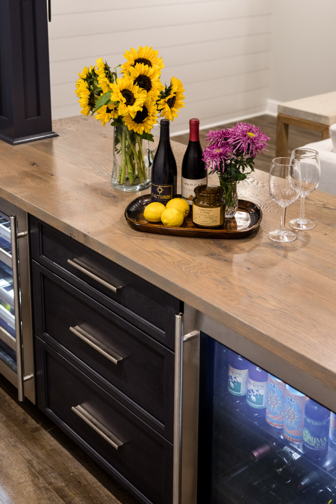 Inspiration for a large transitional underground laminate floor and brown floor basement remodel with gray walls and no fireplace