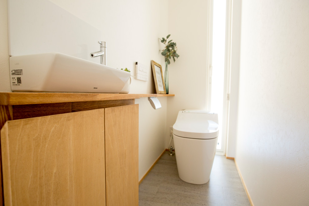 This is an example of a scandinavian powder room in Other.