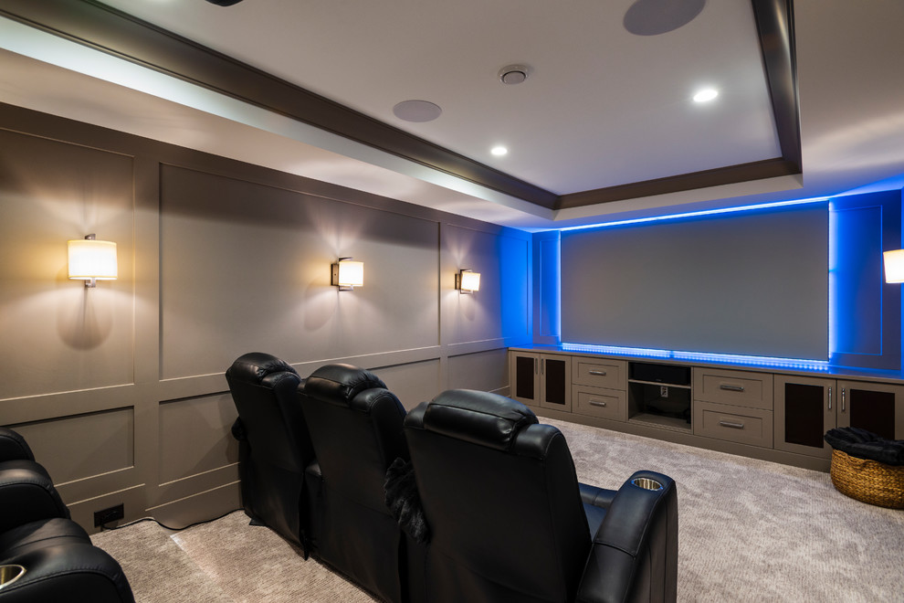 Inspiration for a mid-sized country enclosed home theatre in Vancouver with grey walls, carpet, a projector screen and grey floor.